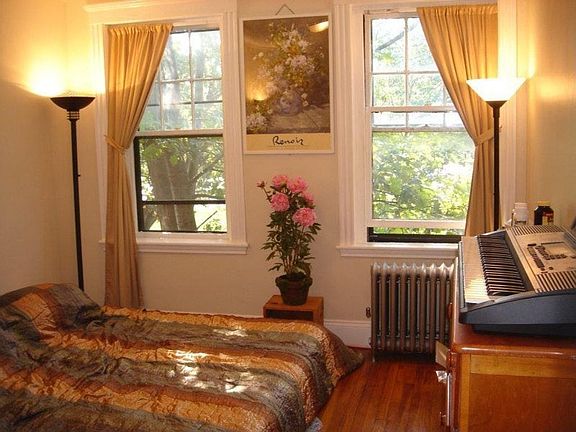 Bedroom with lights before window renovation