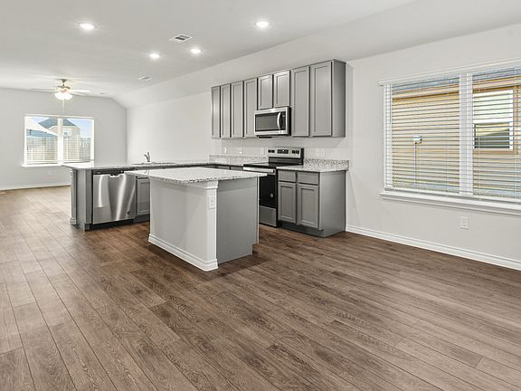 Dining to kitchen and family room