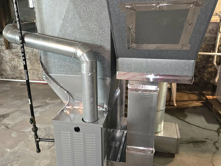 Newer furnace to the right for lower rental unit