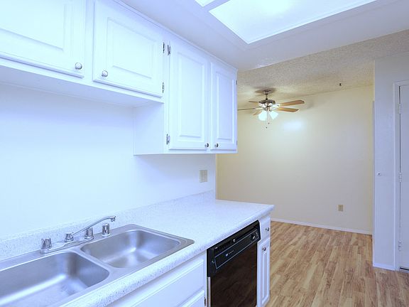 Kitchen showing cupboards and sink