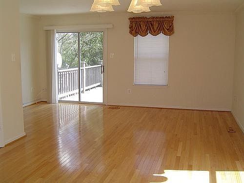 Family room with wood floor and a larger deck