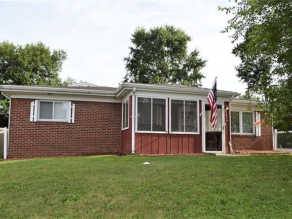 Enclosed front porch & fenced front yard.