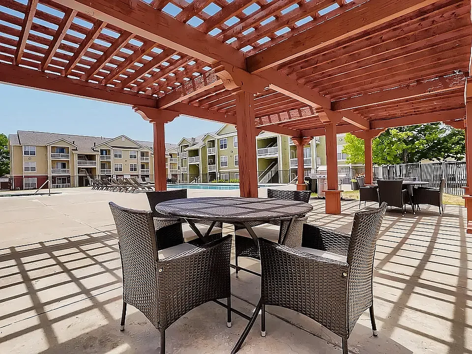 Shaded outdoor seating under our pergola here at The Orchards at Cherry Creek Park Apartments