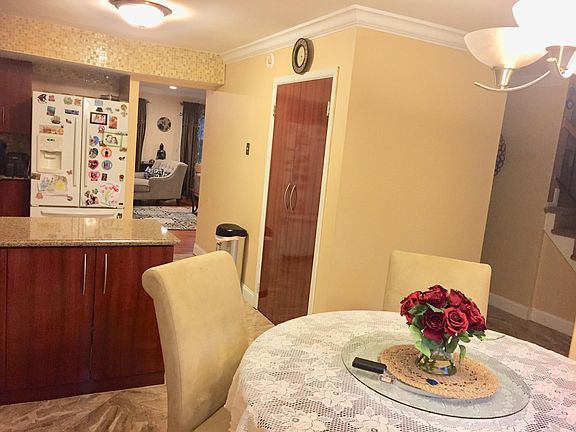 Large eat in kitchen with Quartz counter top and 2 large pan