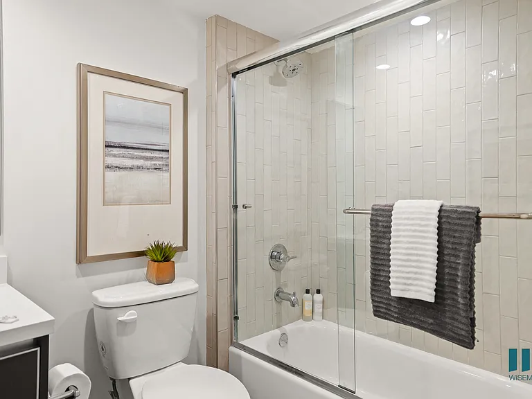 Full-Size Bathroom with Bathtub with Glass Door