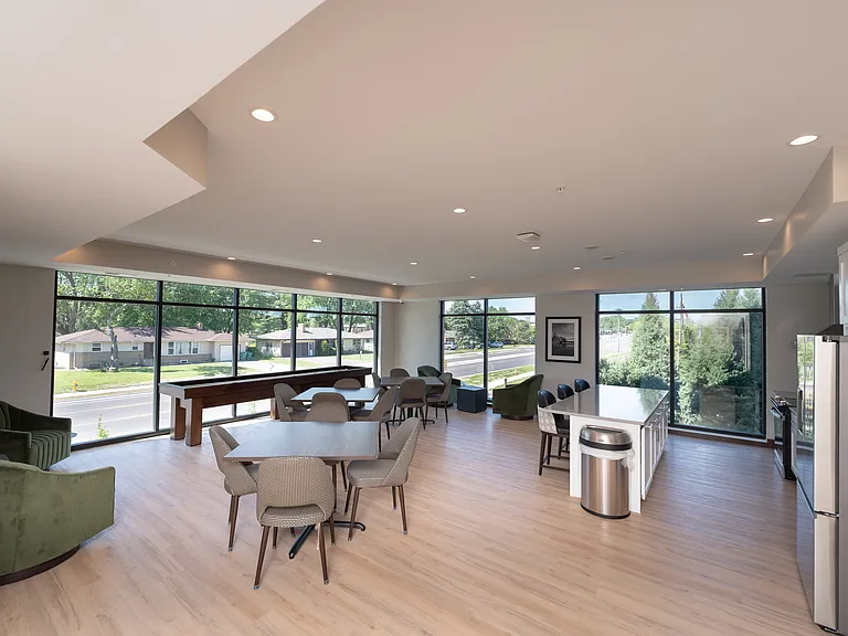 A shared community kitchen and seating area for gatherings and everyday use.