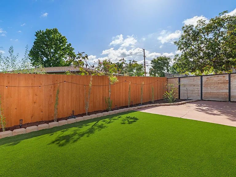 Clean and low-maintenance, this private outdoor space borders a natural ravine, ensuring a tranquil and quiet retreat.