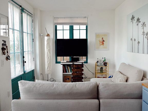 Living room can be utilized as both a dining and media area.