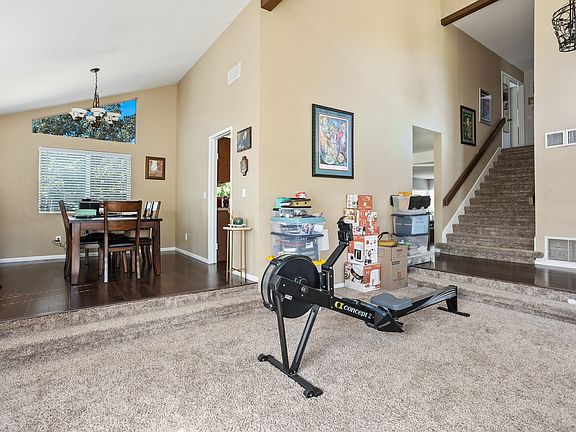 Living Room and Dining Room With Stairs