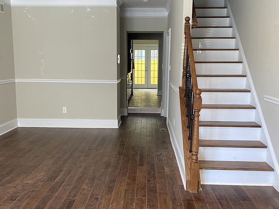 Sun filled living room with new hardwood floor