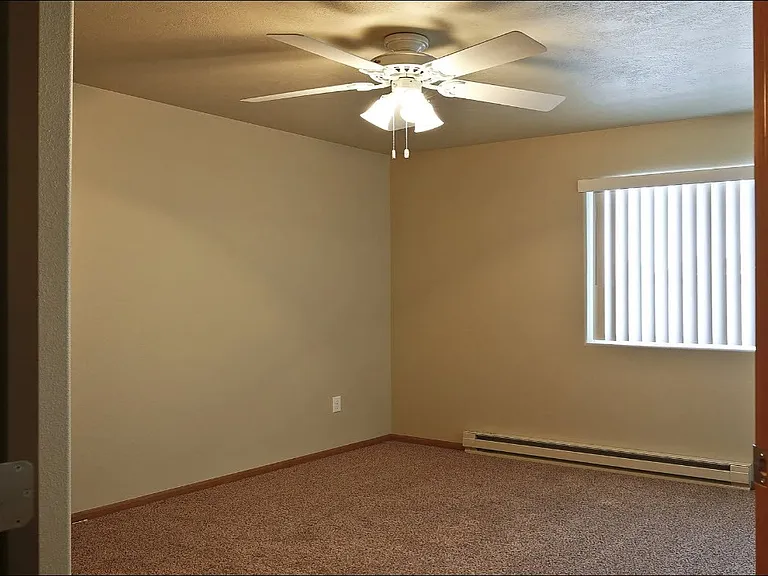 Welcome to Northdale Apartments, where spacious living meets comfort. Enjoy ample natural light, a cozy ceiling fan, and a welcoming atmosphere in this inviting room. Your new home awaitsschedule a tour today!
