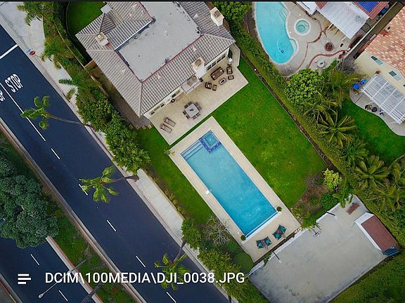 Aerial shot Palm and Ofelia Lane more than 2 lots. Pool, yard, back court for 2 Permanent Basketball hoops, pickle ball court set up, volleyball set up. Also can was used as roller hockey court.