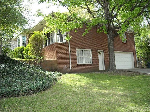 house side with garage and downstairs bedroom