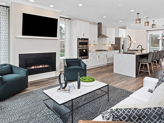 Open concept living room and kitchen In a DRB Homes Grable II model in the South Park community.
