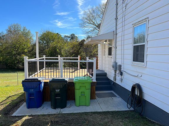 Driveway View of Home & Deck