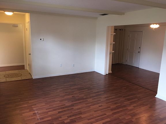 Large living room with good natural lighting.