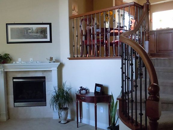 leads into split-level living with dining at the top of the staircase