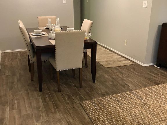 Dining Room with new light fixture and vaulted ceilings.
