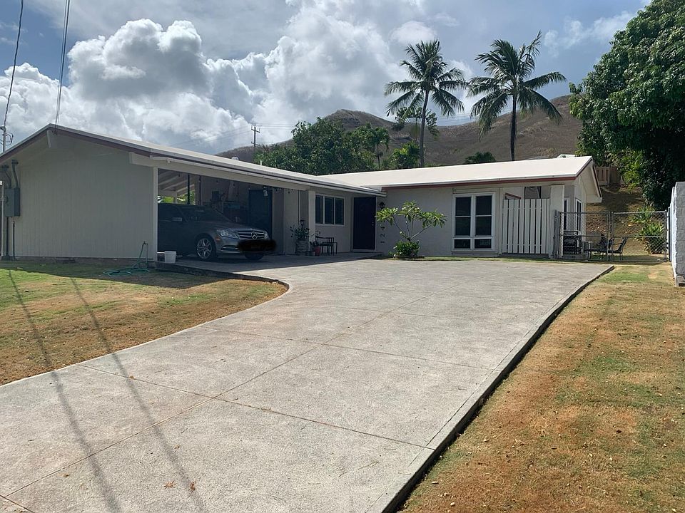 Carport parking for 2 cars plus additional driveway space