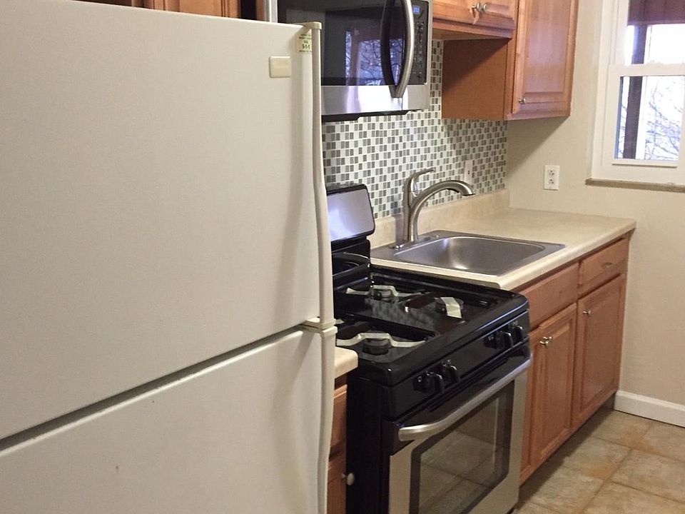 Kitchen with new stove, microwave and backsplash