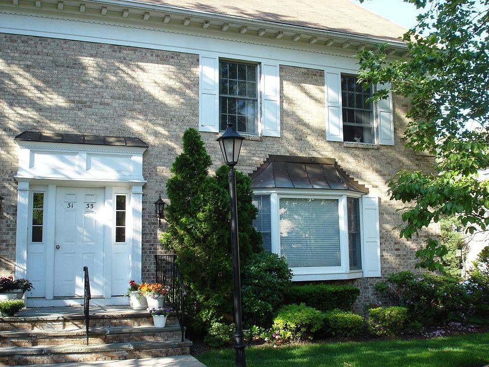 Condo Exterior - 1st Floor End-Unit with Bay Window