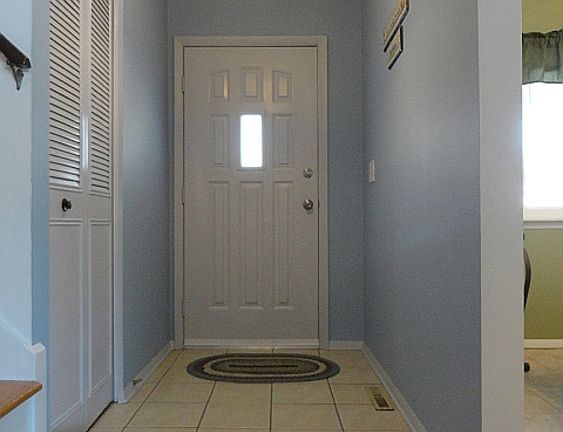 Upon entering through the newer steel front entrance door, you'll find yourself in this attractive formal foyer with durable ceramic flooring and an amply sized coat closet!