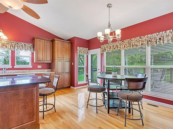 Beautiful Hardwood floors with tons of cabinet space in the kitchen.