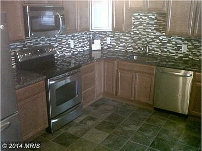 Rehabbed-SS app, granite counters, ceramic tile