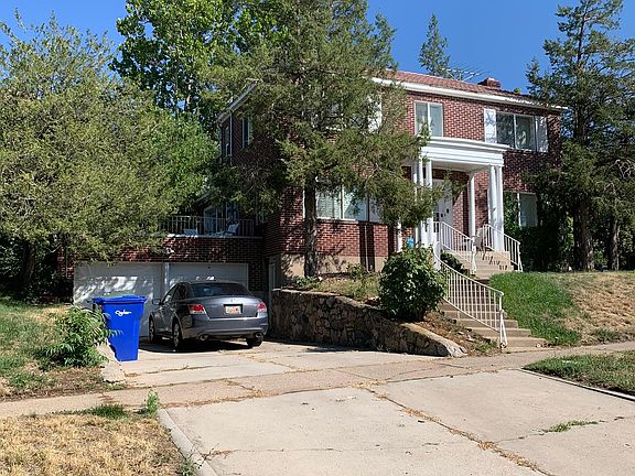 North West View of House, apartment entrance to the right of the the garage