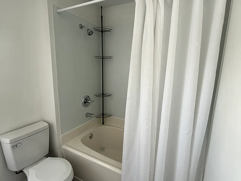 Bathroom - view of shower/tub and toilet