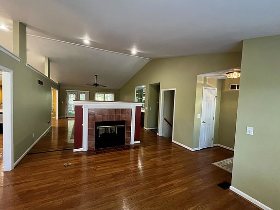 A two sided gas fireplace separates the dining from the family room.