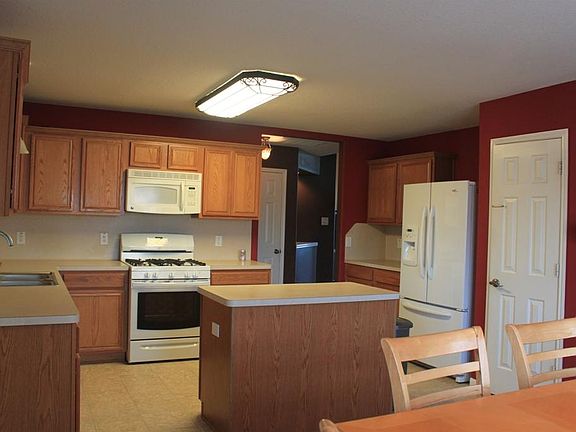 Island kitchen with lots of cabinets and counter space.
