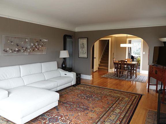 Spacious living room with Roku TV.