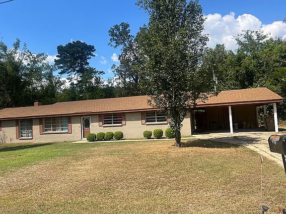 Front view w/ carport