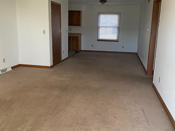 view of living room, dining room from front door