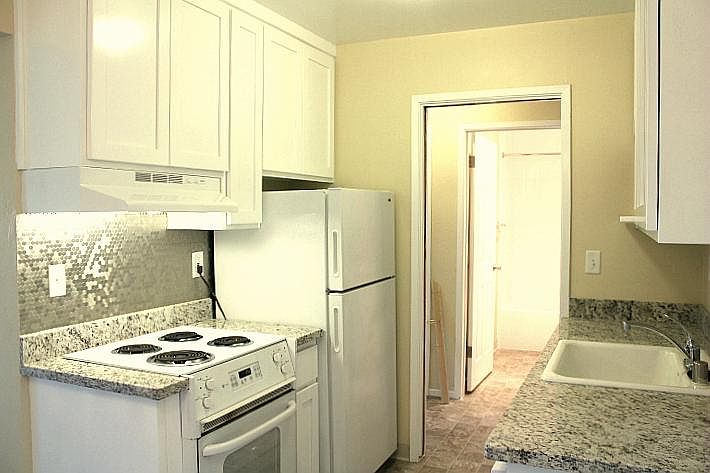 This one-bedroom apartment has new, granite countertops and a new stove backsplash!