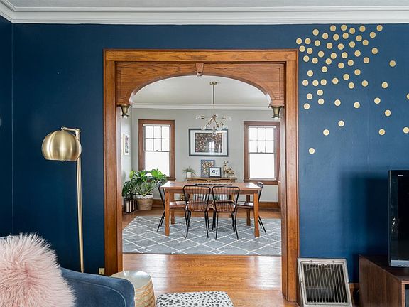 Wood archway with original light fixtures