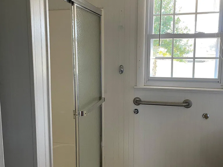Bathroom w/ Shower. Potty is higher height for convenience. Lots of natural light.