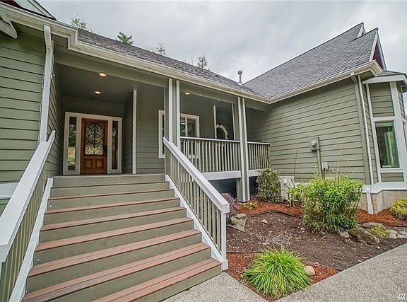 Wide stairs lead up to slate porch