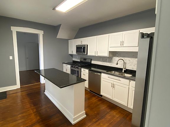 Brand new kitchen with granite countertops.