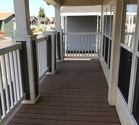 The lovely front porch is on the north side of the home.  What a great spot to relax and chat with friends!