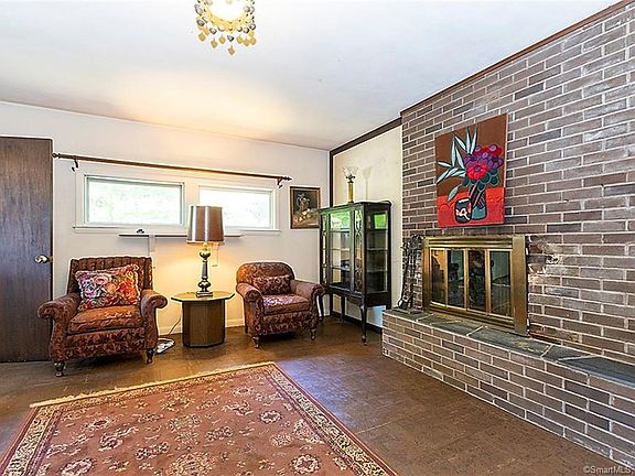 Another view of the family room with a 2nd doorway which leads outside to the driveway.