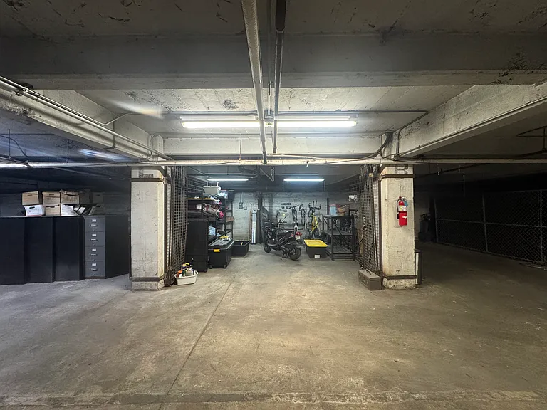 Parking in garage with storage racks and security gate/lock