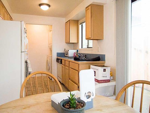 The full sized washer dryer are in that area at the back of the kitchen