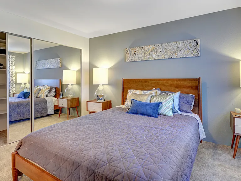 King sized bedroom featuring wall to wall carpeting