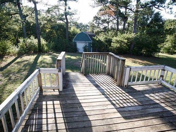 Large deck and outbuildin