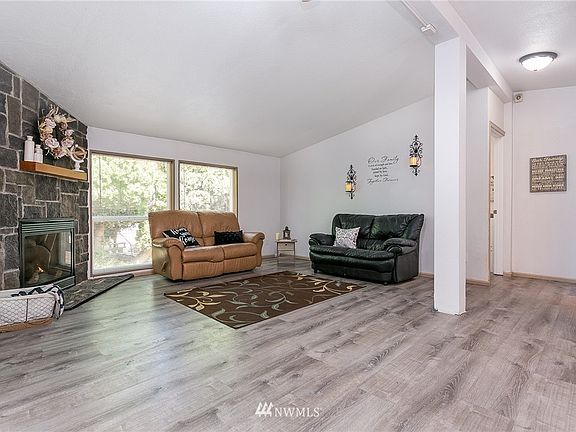 Living room side of great room with cozy fireplace