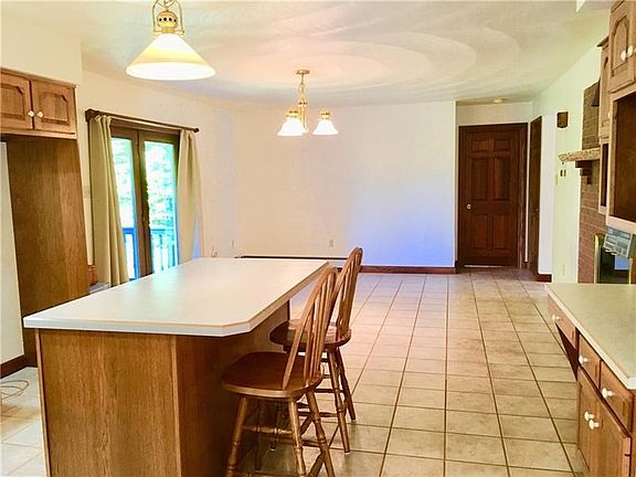 Built in Island with settings for two and storage beneath, a built in desk to look up new recipes for your next holiday celebrat