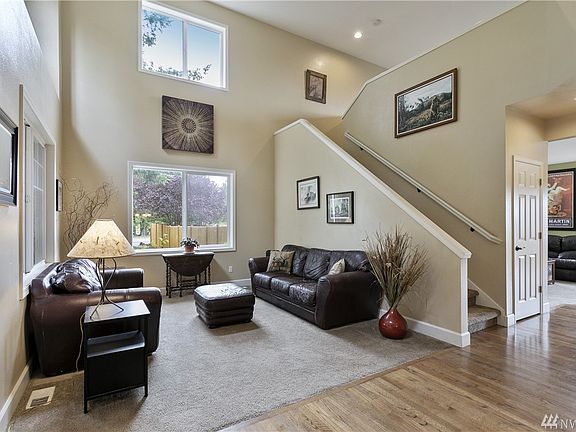 Formal living room drenched in sunlight.