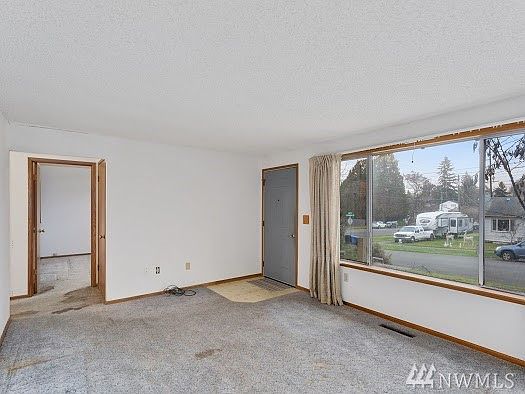 Front Room/entry area with large picture windows!
